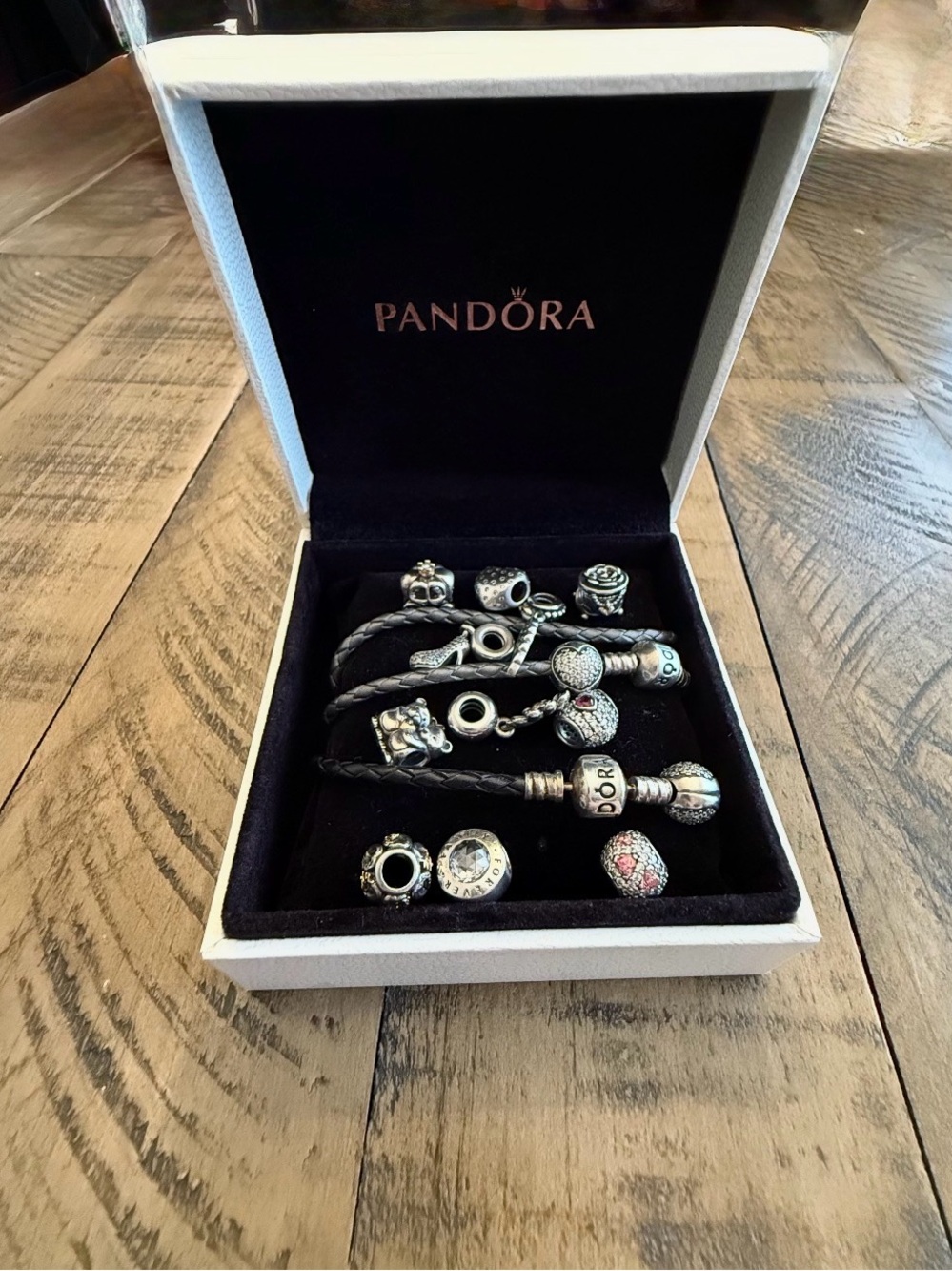 Pandora Silver Charms on Black Leather Bracelets with Pink Accents